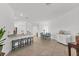 Bright and airy living room features an open floor plan, tiled floors, and neutral décor at 5311 White Sand Cv, Bradenton, FL 34211