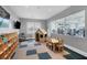 play area with playhouse, TV, table, chairs and view of a fitness center at 5311 White Sand Cv, Bradenton, FL 34211