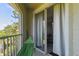 Relaxing condo balcony featuring a hammock and sliding glass doors leading to the living area at 5401 Bentgrass Dr # 1-302, Sarasota, FL 34235