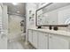 Bright bathroom featuring a shower-tub combo and plants at 5401 Bentgrass Dr # 1-302, Sarasota, FL 34235