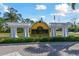 Welcome to Las Palmas, luxury condominiums sign with lush landscaping and a beautiful entrance at 5401 Bentgrass Dr # 1-302, Sarasota, FL 34235