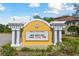 Community sign with white columns announces the BOD meeting at 5401 Bentgrass Dr # 1-302, Sarasota, FL 34235