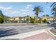 Condominium exterior with plenty of parking in front of the complex and lush landscaping at 5401 Bentgrass Dr # 1-302, Sarasota, FL 34235