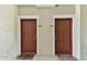 Exterior shot of two front doors with secure locks, door mats, and unit numbers 101 and 102 at 5401 Bentgrass Dr # 1-302, Sarasota, FL 34235