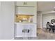 View of kitchen from dining area showing a breakfast bar and stainless steel appliances at 5401 Bentgrass Dr # 1-302, Sarasota, FL 34235