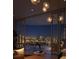 Balcony at night with comfortable seating and stunning city skyline views at 550 Golden Gate Point # 201, Sarasota, FL 34236