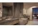 Luxurious bathroom with dual vanities, soaking tub, and modern fixtures at 550 Golden Gate Point # 201, Sarasota, FL 34236