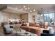 Open-concept living space with modern furniture and hardwood flooring at 550 Golden Gate Point # 201, Sarasota, FL 34236