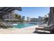 Resort-style pool deck, with sun loungers and scenic city views at 550 Golden Gate Point # 201, Sarasota, FL 34236