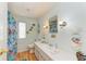 Fun bathroom decorated with colorful fish, seashell accents, and nautical themed accessories at 5619 Bayshore Rd # 107, Palmetto, FL 34221