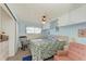 Cozy bedroom with blue walls, a rocking chair, and lots of storage space at 5619 Bayshore Rd # 107, Palmetto, FL 34221