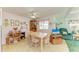 Cozy dining area with table, four chairs, and view to living room at 5619 Bayshore Rd # 107, Palmetto, FL 34221
