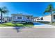 Charming single-story home featuring a cozy front porch, carport and well-maintained landscaping at 5619 Bayshore Rd # 107, Palmetto, FL 34221