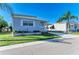 Charming single-story home featuring a cozy front porch with well-maintained landscaping at 5619 Bayshore Rd # 107, Palmetto, FL 34221