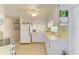 Efficient kitchen featuring white cabinetry, appliances, and ample counter space at 5619 Bayshore Rd # 107, Palmetto, FL 34221