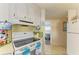 View of the kitchen shows cabinetry, appliances, and a modern range at 5619 Bayshore Rd # 107, Palmetto, FL 34221