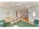 Inviting living room boasts comfortable seating, ceiling fan, and an open floor plan at 5619 Bayshore Rd # 107, Palmetto, FL 34221