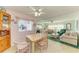 Open living and dining area featuring bright windows, and a cozy atmosphere for entertaining at 5619 Bayshore Rd # 107, Palmetto, FL 34221