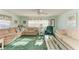 Bright and airy living room featuring comfortable seating and large windows for natural light at 5619 Bayshore Rd # 107, Palmetto, FL 34221