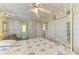 Tranquil main bedroom boasts a canopy bed, ample closets, and a cozy sitting area at 5619 Bayshore Rd # 107, Palmetto, FL 34221