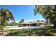 Spacious ranch home features a tile roof, attached garage, and paved circular driveway at 5714 38Th E Ave, Bradenton, FL 34208