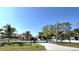 Charming home with a secure gated entrance and palm trees lining the driveway at 5714 38Th E Ave, Bradenton, FL 34208