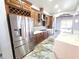 Gourmet kitchen with stainless steel appliances, custom cabinets, and tile backsplash at 5714 38Th E Ave, Bradenton, FL 34208