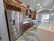Modern kitchen featuring custom cabinets and a stainless steel refrigerator at 5714 38Th E Ave, Bradenton, FL 34208