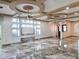 Open living room with decorative ceilings, tile flooring, and wall niches at 5714 38Th E Ave, Bradenton, FL 34208