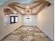 Spacious living room with custom lighting and elegant tile flooring at 5714 38Th E Ave, Bradenton, FL 34208
