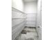 Spacious pantry features ample shelving and attractive marble flooring for organized storage at 5714 38Th E Ave, Bradenton, FL 34208