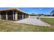 Screened-in patio features a gray brick-paved surface with a fire pit area and exterior views at 5714 38Th E Ave, Bradenton, FL 34208