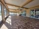 A large sunroom featuring tile floors and surrounded by multiple windows for lots of natural light at 5714 38Th E Ave, Bradenton, FL 34208