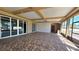 Beautiful sunroom featuring tile floors and sliding glass doors to provide a seamless transition to the outdoors at 5714 38Th E Ave, Bradenton, FL 34208