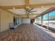 A spacious sunroom boasts tile floors, a tray ceiling, and sliding glass doors to let in natural light at 5714 38Th E Ave, Bradenton, FL 34208