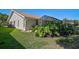 The exterior of home highlighting the backyard and screened-in patio, showing the exterior of the home at 6017 Marella Dr, Sarasota, FL 34243