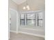Cozy breakfast nook featuring a bay window with natural light and an elegant chandelier at 6017 Marella Dr, Sarasota, FL 34243