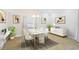 Bright dining room featuring a marble dining table, modern chandelier, and neutral décor at 6017 Marella Dr, Sarasota, FL 34243