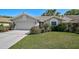 Charming one-story home featuring manicured landscaping that adds to its curb appeal at 6017 Marella Dr, Sarasota, FL 34243