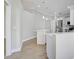 Modern kitchen with white cabinetry, quartz countertops, and stainless steel appliances at 6017 Marella Dr, Sarasota, FL 34243