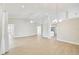 Open-concept living room featuring tile flooring, recessed lights, and access to kitchen and other rooms at 6017 Marella Dr, Sarasota, FL 34243