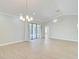 Bright, open living area featuring tile flooring, recessed lighting, and access to the lanai at 6017 Marella Dr, Sarasota, FL 34243