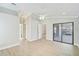 Spacious main bedroom with tile floors, vaulted ceiling, ceiling fan, and sliding glass doors at 6017 Marella Dr, Sarasota, FL 34243