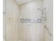 Walk-in shower with tile surround, built-in niche, and modern fixtures at 6017 Marella Dr, Sarasota, FL 34243
