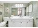 Bathroom featuring white vanity, neutral walls, and decorative lighting at 612 Bird Bay S Dr # 116, Venice, FL 34285
