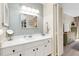 Bathroom vanity with ample counter space and storage cabinets, paired with updated lighting at 612 Bird Bay S Dr # 116, Venice, FL 34285