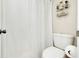 Small toilet room with a toilet and storage shelves at 612 Bird Bay S Dr # 116, Venice, FL 34285