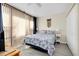 Comfortable bedroom featuring a cozy bed with a patterned comforter and bright, natural light at 612 Bird Bay S Dr # 116, Venice, FL 34285