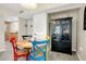 Bright dining area showcasing a round wooden table with colorful chairs and built in shelving at 612 Bird Bay S Dr # 116, Venice, FL 34285