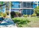Building exterior showing lawn, garden, entry, and screened in balcony at 612 Bird Bay S Dr # 116, Venice, FL 34285